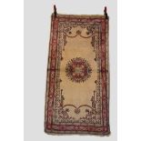 Two rugs: Sparta rug, south west Anatolia, circa 1930s, 4ft. 10in. X 2ft. 7in. 1.47m. X 1.12m. Cream
