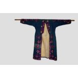 Uzbek blue cotton robe, Uzbekistan, early 20th century, embroidered in coloured silks to the collar,