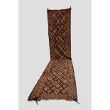 Kurdish ghileem runner, north west Persia, early 20th century, 18ft. 10in. X 3ft. 11in. 5.74m. X 1.