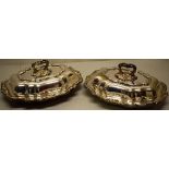 A pair of Victorian oblong electroplated entree dishes, with rococo spray scrolling borders to the