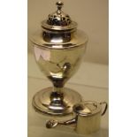 A George III silver vase shape muffineer, the pierced lift off cover with a globe finial, gilded