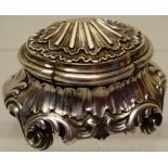 A nineteenth century French cast silver rococo salt, with a hinged scallop shell cover, gilded