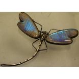 An attractive late nineteenth century Chinese silver dragonfly brooch, the wing with glazed blue