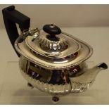 A silver bachelors teapot, with part fluted sides, a swan neck spout, gadroon edge flange and hinged