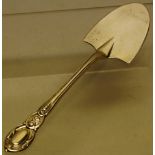 A Victorian silver butter spade, with a cartouche handle, Maker I & H Lias, London 1852.