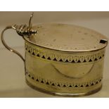 A George III silver oval mustard pot, the sides with pierced engraved hinged lid with thumbpiece, to