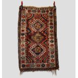 Five small rugs, all 20th century, comprising: Saruk rug, north west Persia, dark blue field with