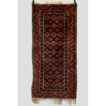 Baluchi rug, Khorasan, north east Persia, circa 1920s, 6ft. 5in. X 3ft. 1in. 1.96m. X 0.94m. Dark
