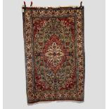 Qum rug, south central Persia, circa 1930s-40s, 6ft. 11in. X 4ft. 7in. 2.11m. X 1.40m. Ivory and red