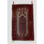 Two north east Afghanistan prayer rugs: the first, a Baluchi rug, mid-20th century, 4ft. 9in. X 2ft.
