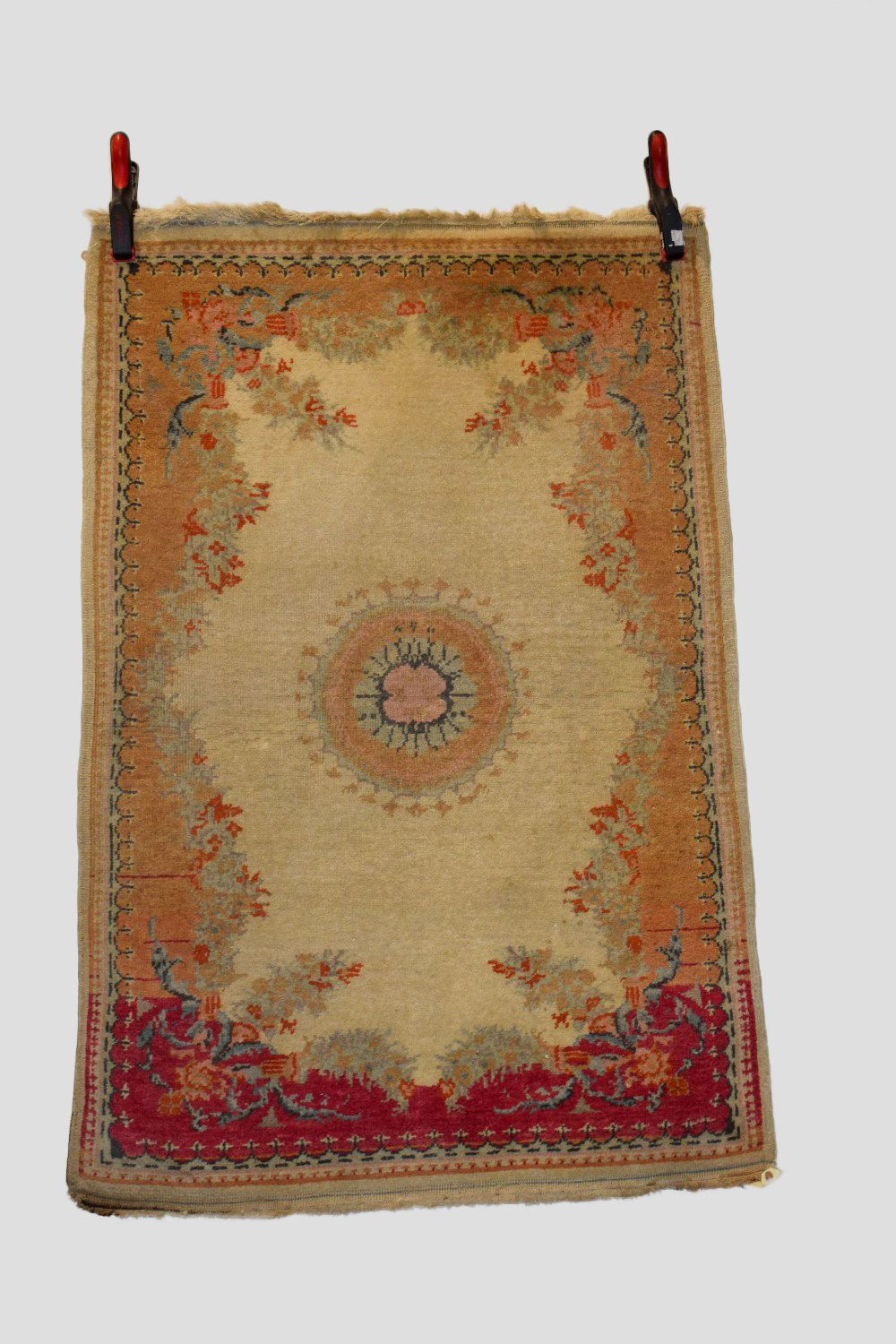 Near pair East European(?) rugs in the French taste, mid-20th century, the first 4ft. X 2ft. 9in.
