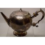 An early George II Scottish provincial silver bullet teapot, with a tapering spout, the shoulder and