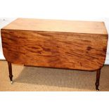 A large Regency faded mahogany Pembroke table, the rectangular drop leaf top with a reeded edge,