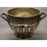 A late Victorian silver punch bowl in early eighteenth century French Regency style, with repousse