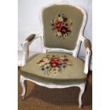 A French beech fauteuil, in Louis XV style, with distressed white paint to the channelled frame, the