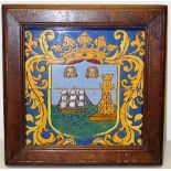 A tile picture, in two halves, of the arms of the City of Cork in Ireland, mounted in an oak