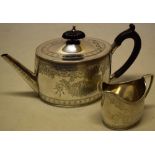 A Victorian silver bachelors oval teapot and milk jug in Georgian style, having engraved borders,