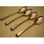 A set of four George III silver Old English pattern bright cut table spoons, engraved a plume of
