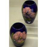 A pair of Moorcroft magnolia vases, impressed mark, 5.3in (13.5cm)