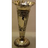An Edwardian silver vase, with pierced scrolling foliage chased decoration, a vacant cartouche, a