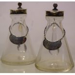 A pair of Edwardian glass noggins for Irish whiskey, with hinged silver lids and labels on chains