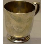 A Victorian silver child's mug, with a cast capped scroll handle and a moulded foot, Maker C.F
