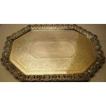 A late Victorian silver oblong tray, the vacant centre with a bright cut band to a foliage flat