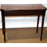 A Regency mahogany card table, the rectangular top with a figured veneered fold over flap, inlaid