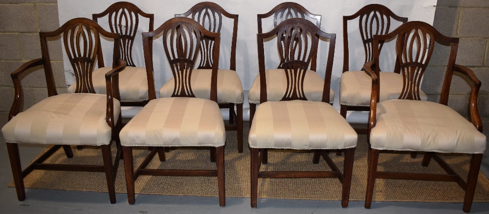 A set of eight mahogany dining chairs of Hepplewhite design, the pierced balloon shape splat backs