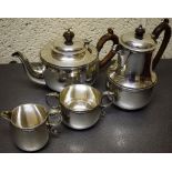 A four piece silver tea service, the circular bodies with fine reeded shell borders, the teapot with