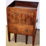 A Regency mahogany bedside night commode, the galleried top above a pair of cupboard doors and a