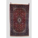 Kashan rug, west Persia, mid-20th century, 7ft. 3in. X 4ft. 6in. 2.21m. X 1.37m. Dark blue, ivory