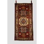 Caucasian design rug, Afghanistan, modern production, 4ft. 7in. X 2ft. 3in. 1.40m. X 0.69m. Dark
