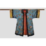 Chinese informal robe, blue silk, early 20th century, embroidered in coloured silks with flowers and