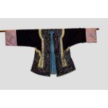 Chinese informal robe of black silk embroidered in coloured silks with small medallions of flowers