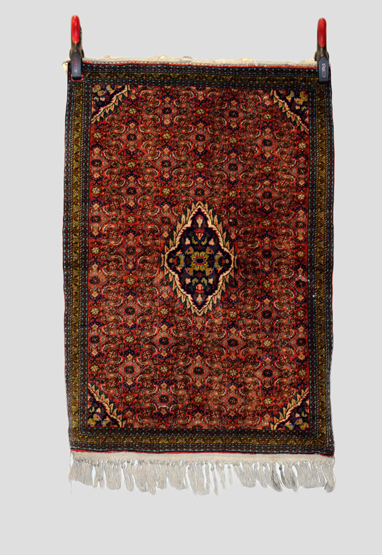 Bijar rug, north west Persia, circa 1950s, 3ft. 3in. X 2ft. 3in. 1m. X 0.69m. Small dark blue centre