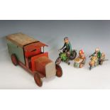 A tin plate lorry with blue and red coach work, rubber rimmed wheels, 45cm long,