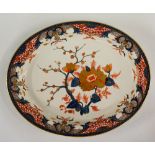 A Derby oval meat plate decorated in Japan palette the centre with floral spray,