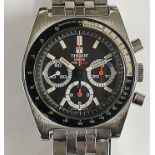 A Tissot stainless steel chronograph the black dial with three subsidiary dials,