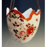 A Japanese porcelain Kutani wear hanging basket of frilled half egg form pierced with three holes