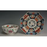 A Chinese octagonal plate decorated in Imari style the under glaze blue panelled decoration