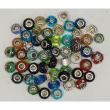 A collection of charm beads, mostly multi coloured glass, otherwise jeweled,