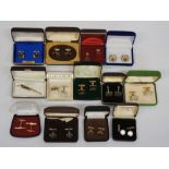 A bag of cufflinks, mostly gold tone geometric styles, one mother of pearl an silver coloured pair,
