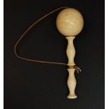 An early 19th Century ivory cup and ball game, 13.