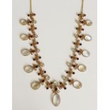 A moonstone fringe necklace the alternate links each set with an oval and circular graduated