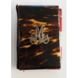 A 19th Century tortoiseshell aide memoire the front inlaid with an engraved silver initial M,