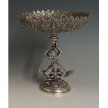 An Indian silver pedestal dish the shaped circular petal bowl embossed with continuous band of
