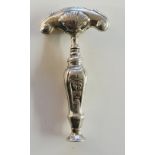 An 18th Century Dutch silver corkscrew, the pull scroll and shell cast,