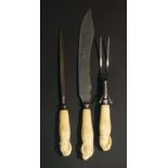 A rare set of three 19th Century marine ivory handled carving implements, comprising steel,