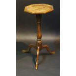 A good mid 18th Century oak candle stand the octagonal top with applied moulded lip above a